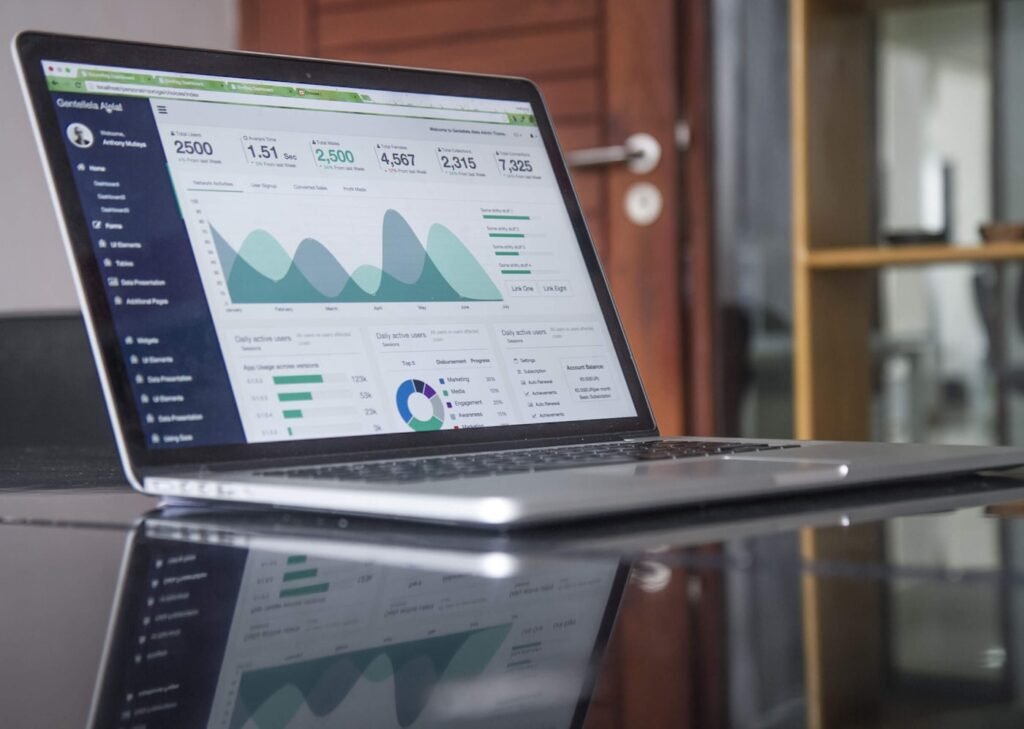 Marketing analytics dashboard showing campaign performance charts on a laptop