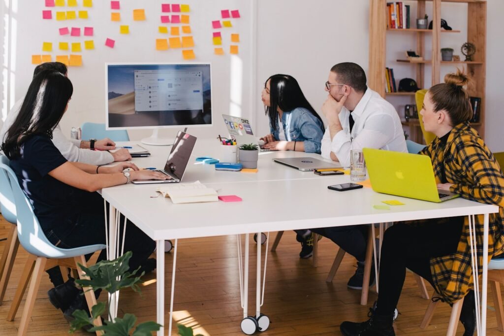 Product and campaign photography laid out on a studio desk